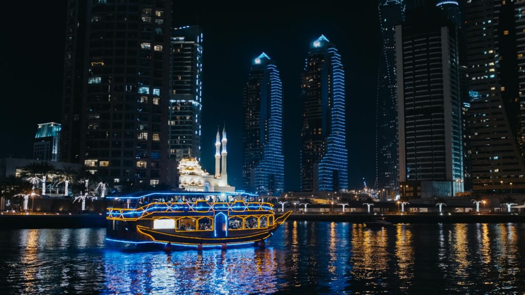 View of Burj Khalifa towering over the Dubai skyline at sunset